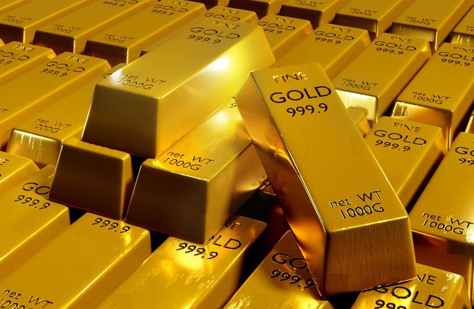 الذهب يكافح للبقاء على مسافة من اعلى مستوياته في شباط